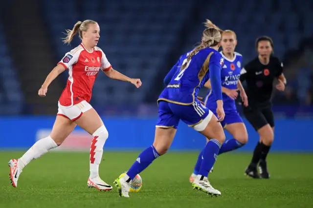 Mead dribbles the ball through the Leicester defence.