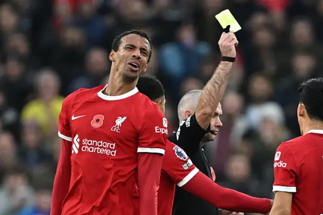 Joel Matip reacts to being yellow carded