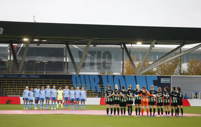 Players observe a minute's silence before kick off at Joie stadium.