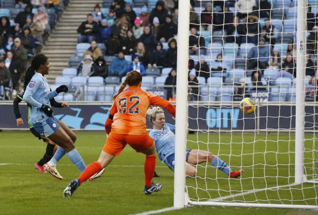 Hemp slides to connect with the ball at the back post as the Brighton stopper looks on helpless.