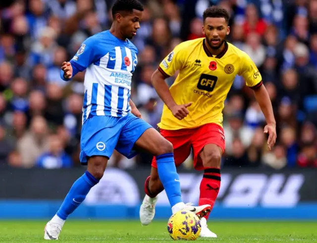 Ansu Fati and Sheffield United's Auston Trusty battle for the ball