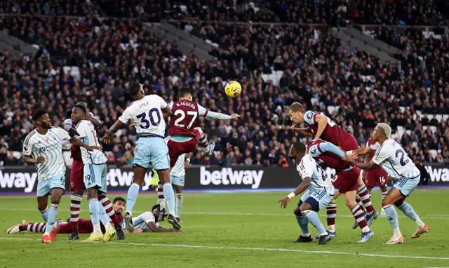 Tomas Soucek heads the ball