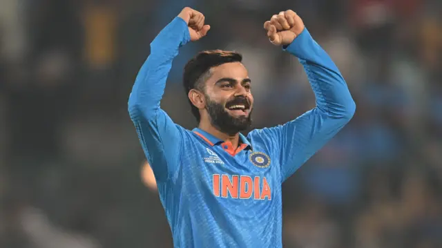 Virat Kohli celebrates the wicket of Scott Edwards