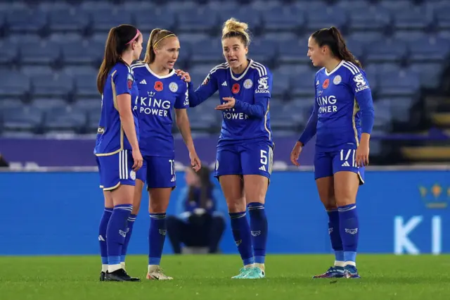 Leicester players huddle together to discuss the errors that led to Arsenal's goals.