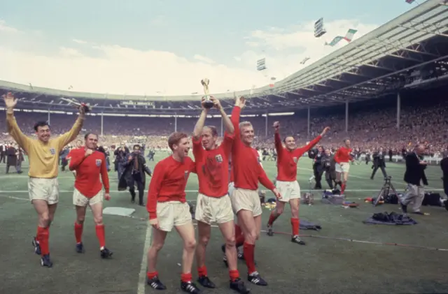 Bobby Charlton holds the trophy aloft following England's famous 4-2 World Cup final victory over West Germany