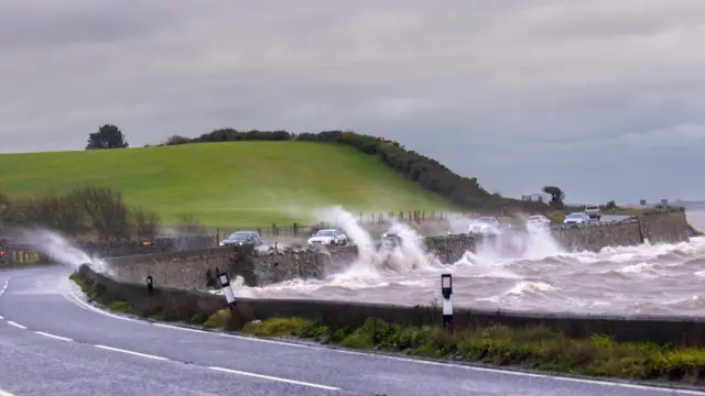 Cars hit by waves off the Portaferry Road