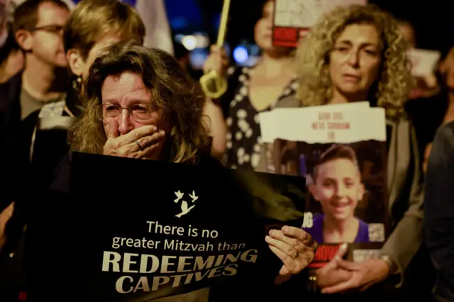 A woman reacts, as people gather in front of the United Nations Headquarters in Jerusalem demanding for action to be taken to return the hostages kidnapped by Hamas during the October 7 attacks