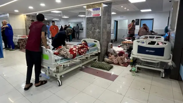 Patients seen lying in hospital beds and on the floor in Al-Shifa hospital