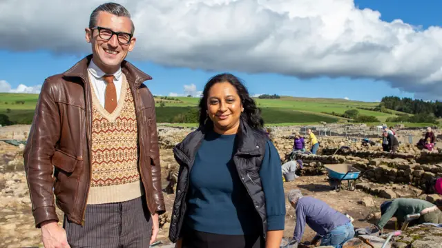 Presenter Ben Shires and archaeologist Raksha Dave at Vindolanda.