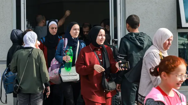 Dual passport holders are in the terminal on the Palestinian side of the Rafah border crossing with Egypt  - 13 November 2023