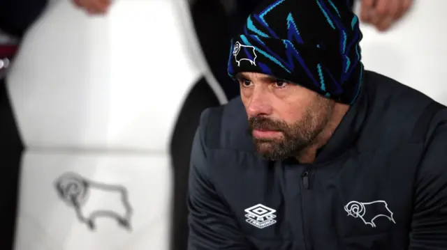 Paul Warne sits in the Derby dugout