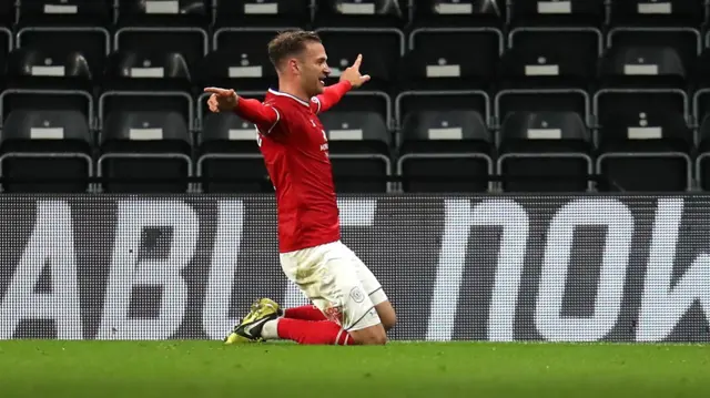 Mickey Demetriou celebrates a goal for Crewe