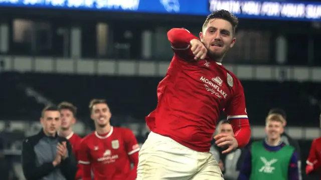 Crewe players celebrate beating Derby