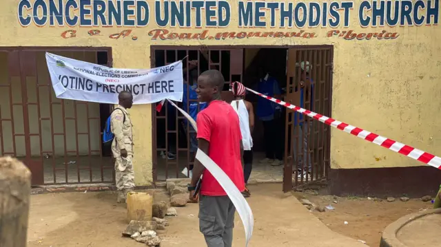 A man entering a centre to vote in Monrovia, Liberia