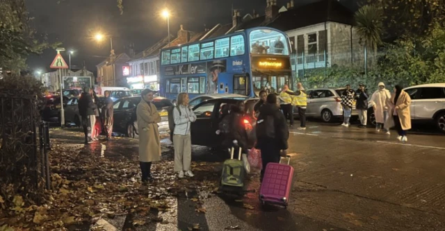 People waiting for buses