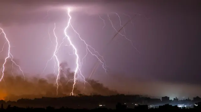 Lightning bolts strike over the Israel border with Gaza as fighting continues between the Palestinian militant group Hamas and Israel, and as seen from Ashkelon, Israel, November 14, 2023. REUTERS/Avi Roccah