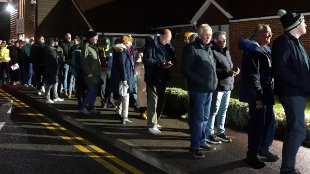 Horsham fans queue to enter stadium