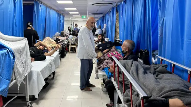 Patients and internally displaced people are pictured at Al-Shifa hospital in Gaza City