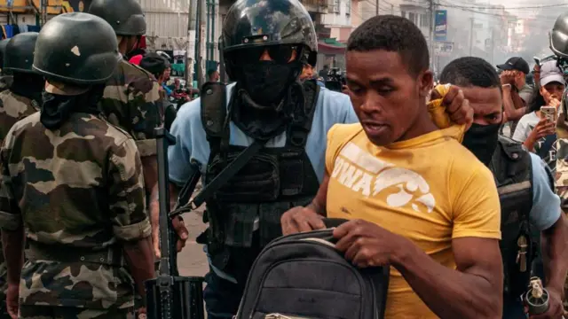 A policeman escorting someone