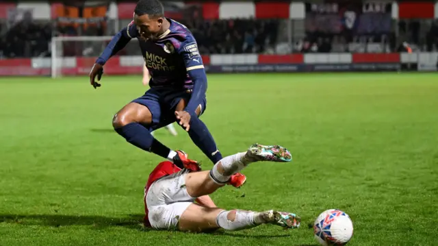 Salford player tackles a Peterborough player