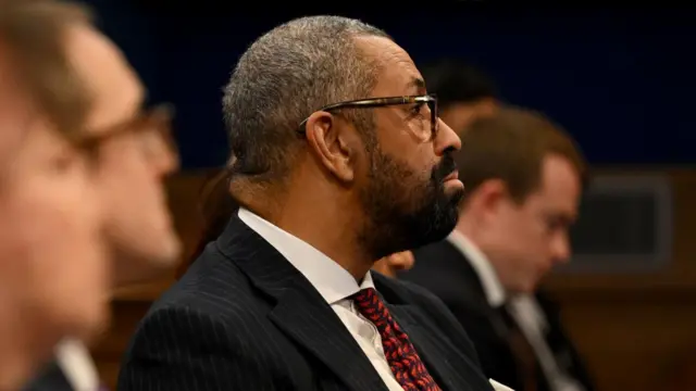 New Home Secretary James Cleverly listens to the PM's press conference