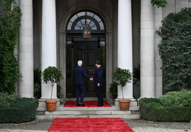 President Biden greets Chinese President Xi Jinping before a meeting