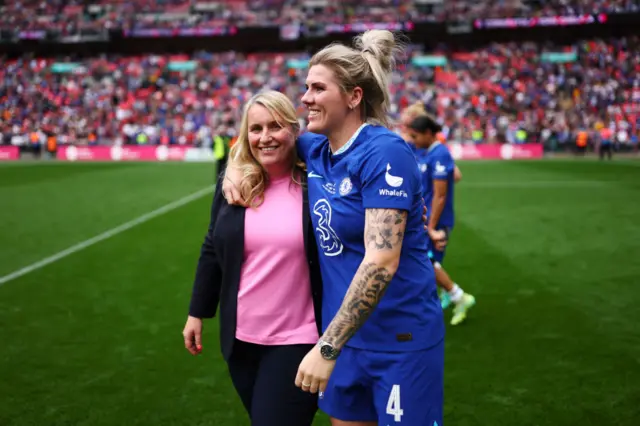 Hayes and Bright embrace on the Wembley pitch after their FA Cup final win.