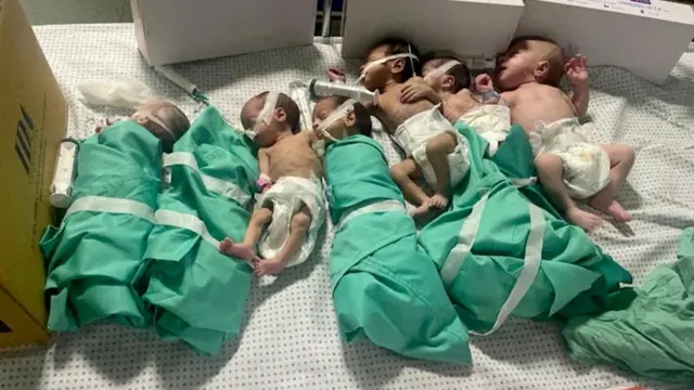 Newborns are placed in bed after being taken off incubators in Gaza's Al Shifa hospital after power outage