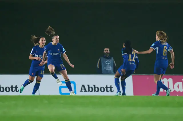 Charles jumps in the air after scoring her first UWCL goal.