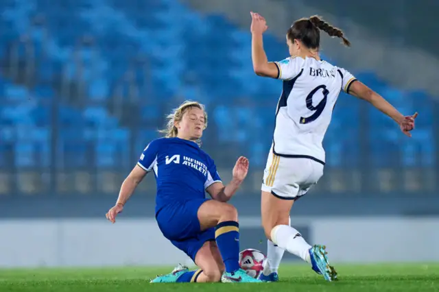 Cuthbert flies into a challenge on Bruun in midfield.