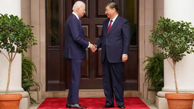 President Biden shakes hands with President Xi