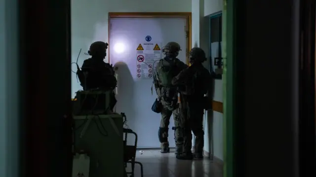 Soldiers are seen inside the hospital