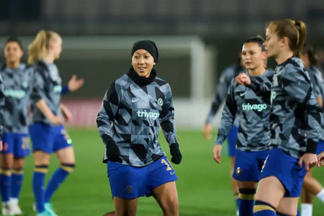 Chelsea players round James warm up.