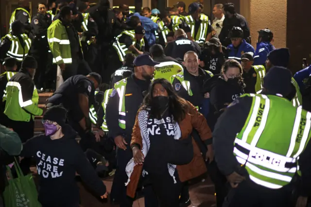 US Capitol Police try to remove protesters from the DNC headquarters during a demonstration