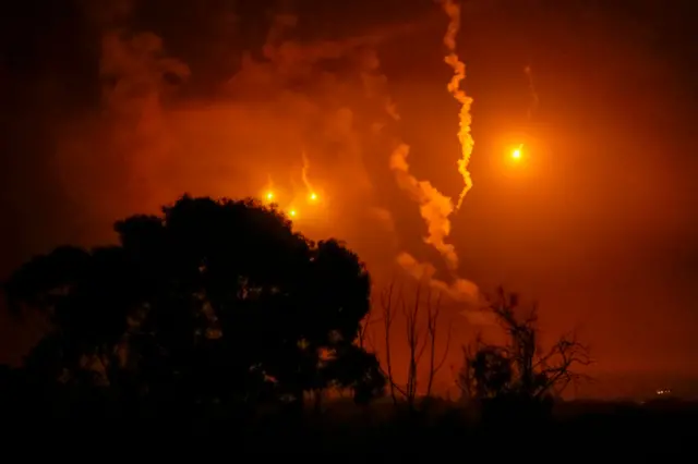 Israeli Defence Force flares light up the sky and landscape over Beit Hanoun, in the northern Gaza Strip on November 15, 2023 viewed from Sderot, Israel