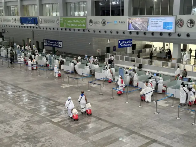 Palestinian pilgrims wait at the Jeddah Airport for passport procedures, after passing through Rafah Border Crossing in Gaza as they arrive in Jeddah, Saudi Arabia on June 13, 2023.