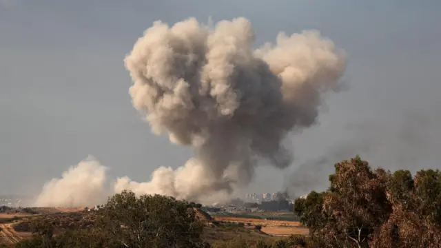 Smoke rises over a landscape