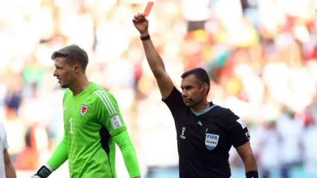 Wayne Hennessey is sent off during last year's World Cup