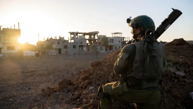 An Israeli soldier takes position during the ongoing ground operation of the Israeli army against Palestinian Islamist group Hamas, at a location given as Gaza