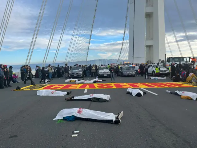 People take part in a protest in support of Palestinians in Gaza, amid the ongoing conflict between Israel and the Palestinian group Hamas, at Bay Bridge, in San Francisco, California,