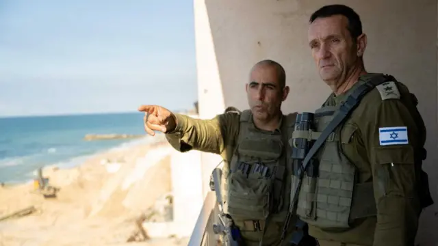 Israeli army Chief of Staff, Herzi Halevi listens to an officer as he visited soldiers during the ongoing ground operation of the Israeli army against Palestinian Islamist group Hamas, in a location given as Gaza