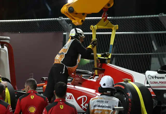 Carlos Sainz car is recovered from the track in Las Vegas