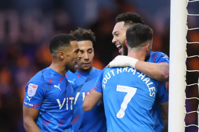 Stockport players celebrate a 12th straight win