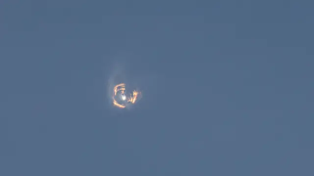 A ring of lights in the Texan sky after Starship's super heavy booster explodes