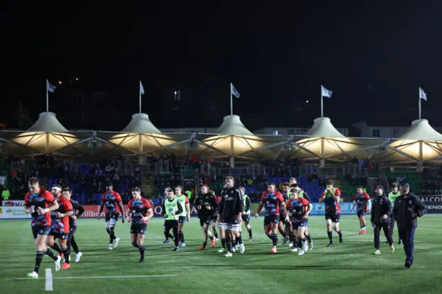 Glasgow Warriors players warm up at Scotstoun ahead of their game against Benetton