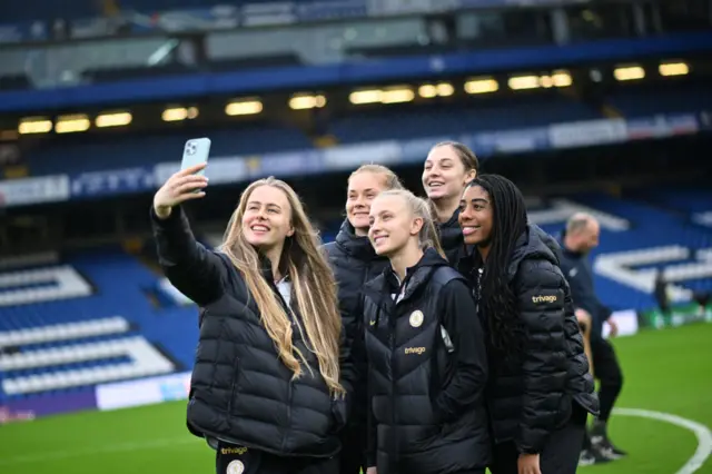 Chelsea women players pose for a photograph