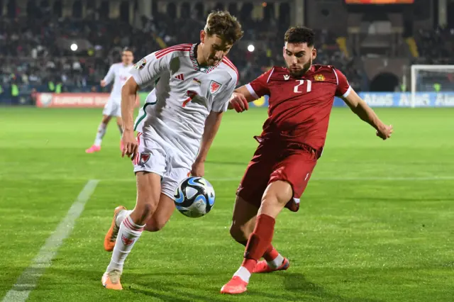 Wales midfielder David Brooks fights for the ball with Armenia defender Nair Tiknizyan