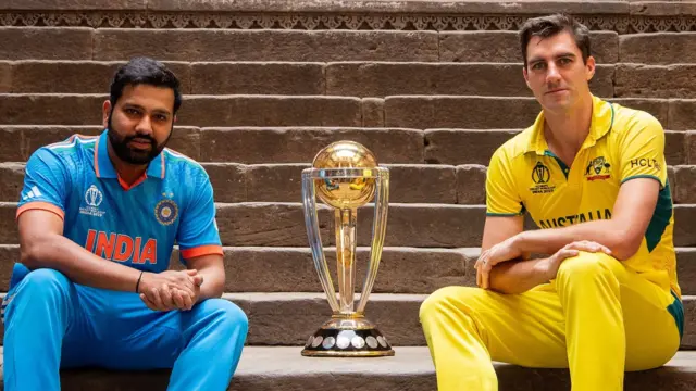 Rohit Sharma and Pat Cummins with the men's Cricket World Cup trophy