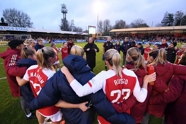 Jonas Eidevall, Manager of Arsenal, talks to the team