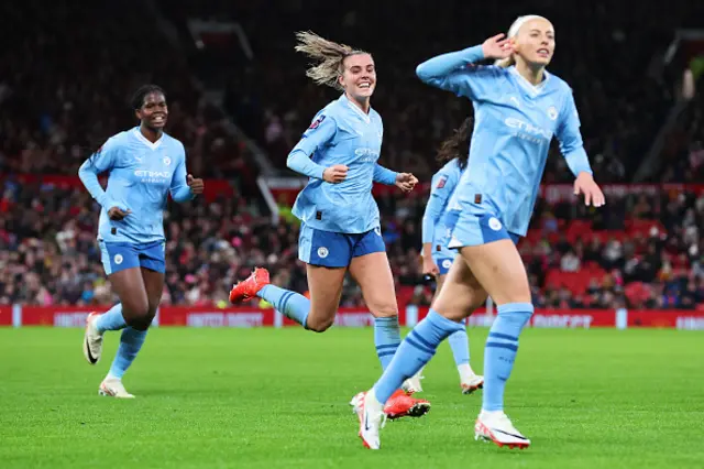 Chloe Kelly cups her ear after Jill Roord's goal